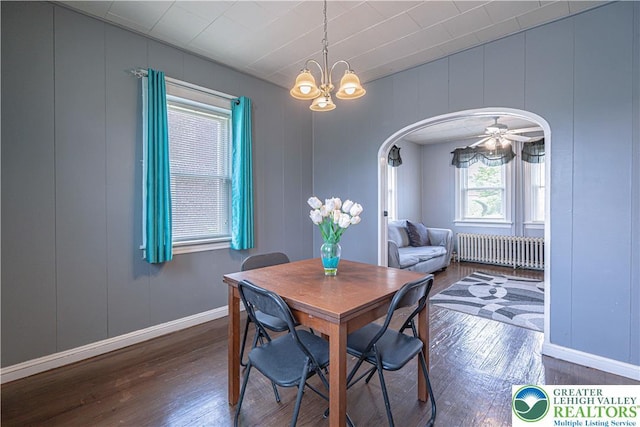 858 Radclyffe St, Bethlehem City, PA 18017 - dining area with radiator, hardwood / wood-style floors, a decorative wall, arched walkways, and a chandelier