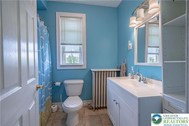 858 Radclyffe St, Bethlehem City, PA 18017 - bathroom with radiator, vanity, and tile patterned floors