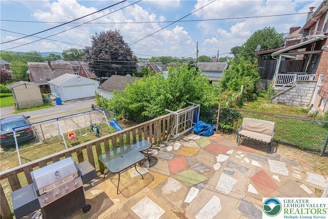 858 Radclyffe St, Bethlehem City, PA 18017 - view of patio with a garage and a playground