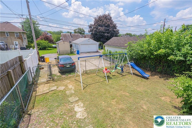 858 Radclyffe St, Bethlehem City, PA 18017 - fenced backyard with a playground and a detached garage