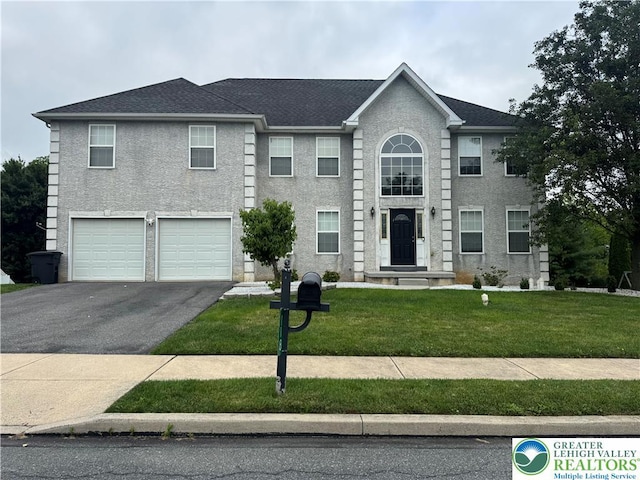 118 Walker Dr, Allen Twp, PA 18067 - colonial-style house with asphalt driveway, an attached garage, and a front yard