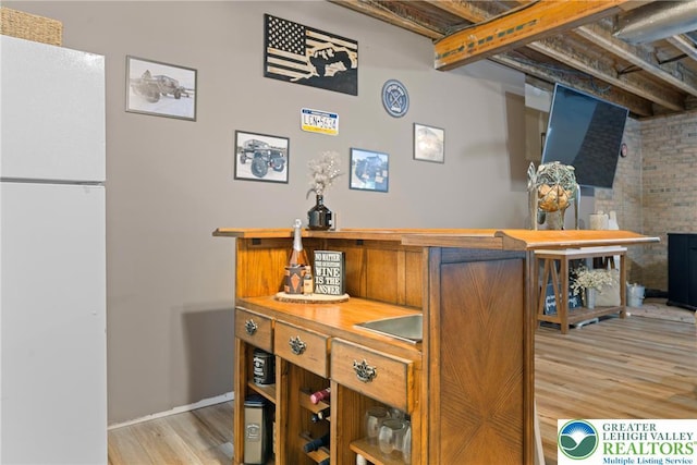 2954 Avery Rd, Washington Twp, PA 18080 - detailed view of freestanding refrigerator, wood finished floors, and a dry bar