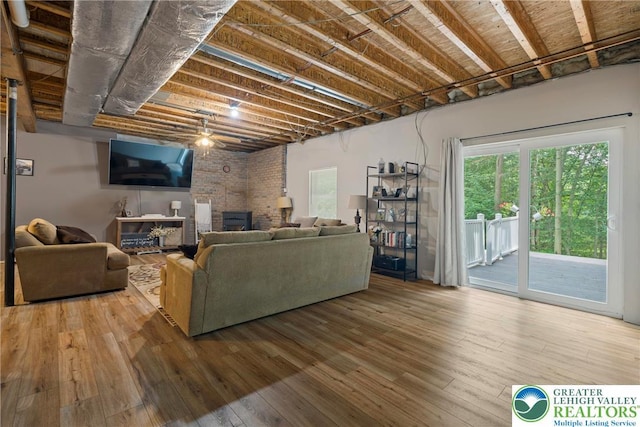 2954 Avery Rd, Washington Twp, PA 18080 - living area with hardwood / wood-style flooring, a ceiling fan, and a fireplace