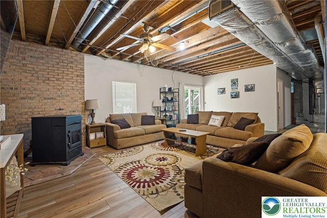 2954 Avery Rd, Washington Twp, PA 18080 - living room with light wood-style floors, a ceiling fan, and a wood stove