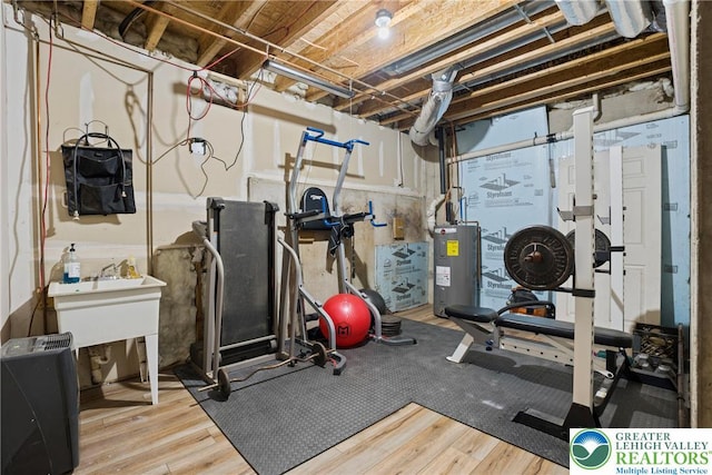 2954 Avery Rd, Washington Twp, PA 18080 - exercise area featuring water heater and wood finished floors