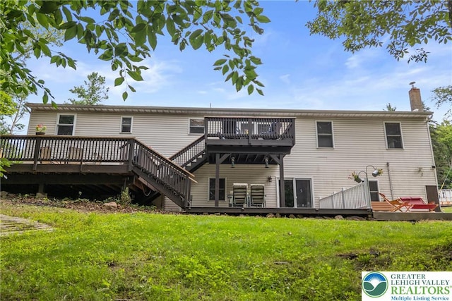 2954 Avery Rd, Washington Twp, PA 18080 - rear view of house featuring a deck, a lawn, and a chimney