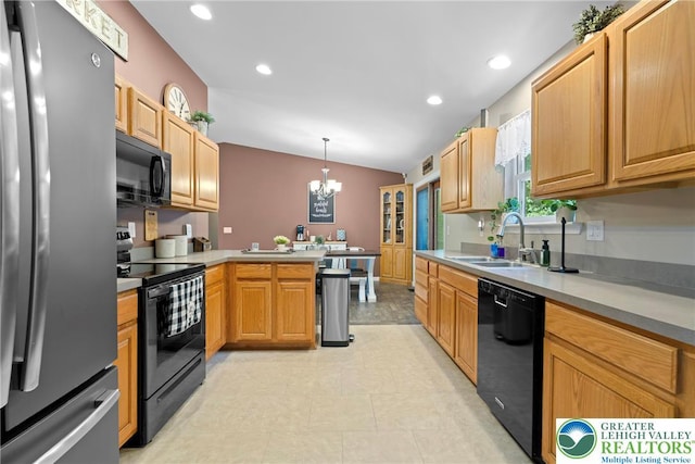 2954 Avery Rd, Washington Twp, PA 18080 - kitchen featuring black appliances, a peninsula, a chandelier, recessed lighting, and hanging light fixtures