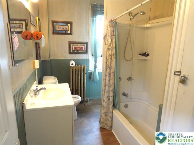 151 W Nesquehoning St, Easton, PA 18042 - full bath with radiator, wood finished floors, shower / tub combo, vanity, and a wainscoted wall