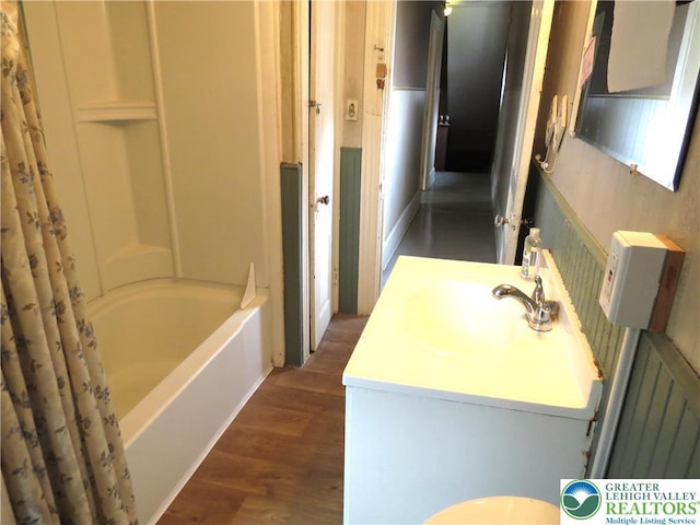151 W Nesquehoning St, Easton, PA 18042 - bathroom featuring wood finished floors, vanity, and shower / bathtub combination with curtain