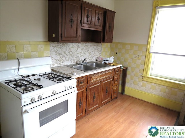 151 W Nesquehoning St, Easton, PA 18042 - kitchen featuring white range with gas cooktop, light countertops, and light wood-style flooring