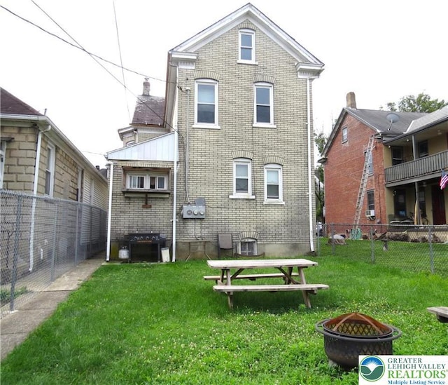 151 W Nesquehoning St, Easton, PA 18042 - back of house featuring a fire pit and brick siding
