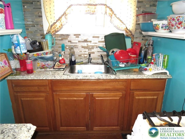 151 W Nesquehoning St, Easton, PA 18042 - kitchen featuring brown cabinets and backsplash