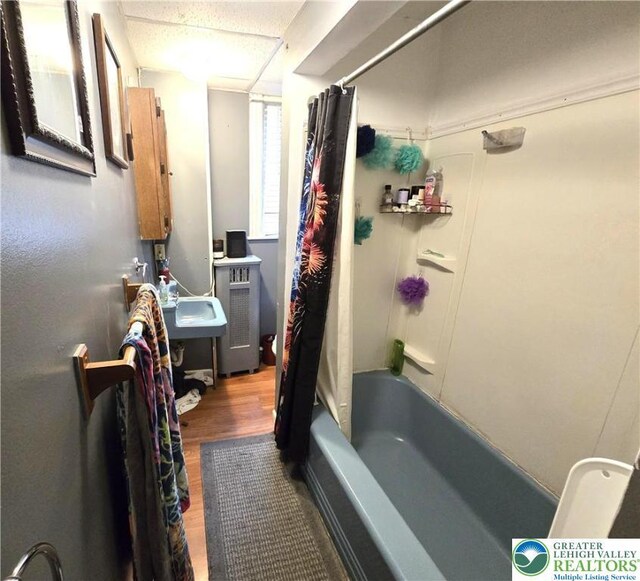 151 W Nesquehoning St, Easton, PA 18042 - bathroom with wood finished floors and shower / bath combination with curtain