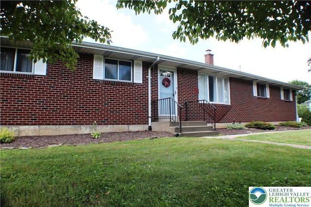 1321 Bushkill Center Rd, Bushkill Twp, PA 18091 - ranch-style home featuring brick siding, a front yard, and a chimney