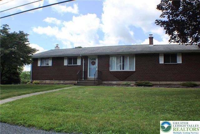 1321 Bushkill Center Rd, Bushkill Twp, PA 18091 - single story home featuring brick siding, a chimney, and a front yard