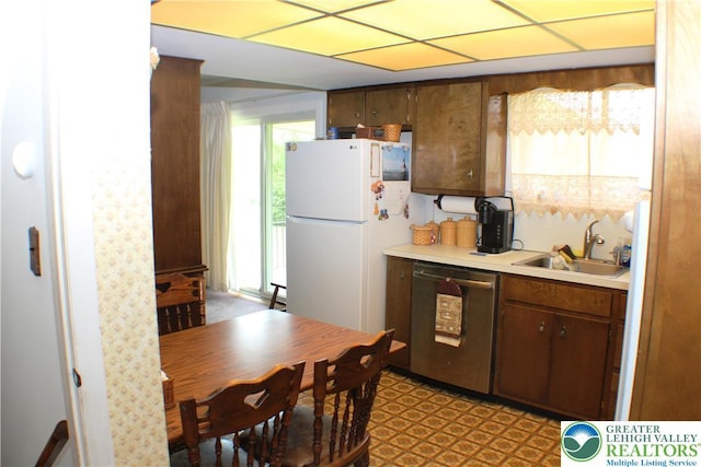 1321 Bushkill Center Rd, Bushkill Twp, PA 18091 - kitchen with stainless steel dishwasher, freestanding refrigerator, light countertops, and light floors