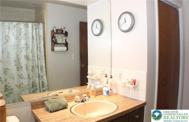 1321 Bushkill Center Rd, Bushkill Twp, PA 18091 - bathroom featuring vanity, decorative backsplash, and a shower with shower curtain