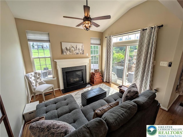 119 Gray Dr, Allen Twp, PA 18067 - living room featuring plenty of natural light, lofted ceiling, wood finished floors, a fireplace with flush hearth, and ceiling fan