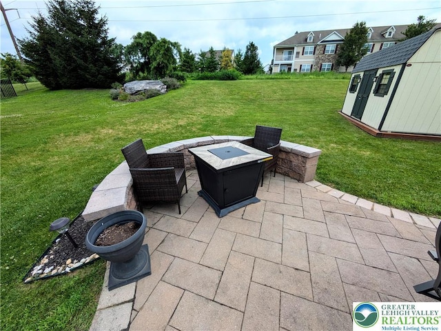 119 Gray Dr, Allen Twp, PA 18067 - view of patio featuring a storage shed and a fire pit