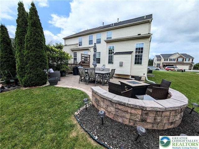 119 Gray Dr, Allen Twp, PA 18067 - back of property with an outdoor fire pit, a patio area, and a lawn