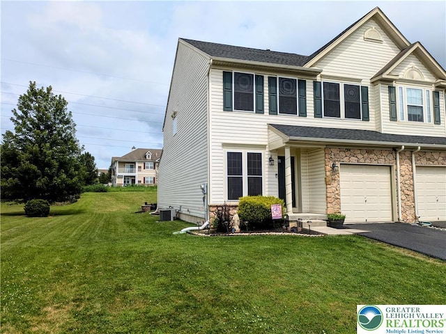 119 Gray Dr, Allen Twp, PA 18067 - view of front of home with a front yard, driveway, an attached garage, and stone siding