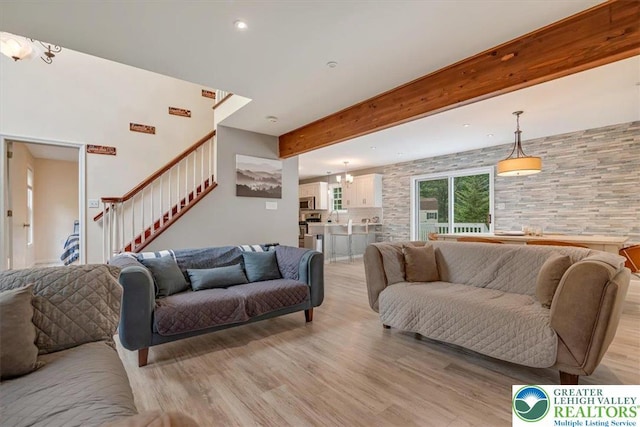 5 Flagstone Ln, East Stroudsburg, PA 18302 - living room with stairs, light wood-type flooring, recessed lighting, beam ceiling, and a chandelier