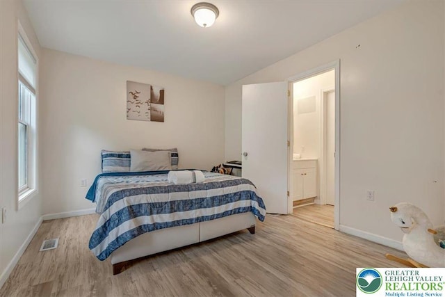 5 Flagstone Ln, East Stroudsburg, PA 18302 - bedroom featuring wood finished floors, lofted ceiling, and ensuite bathroom