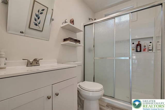 5 Flagstone Ln, East Stroudsburg, PA 18302 - full bathroom featuring vanity, a shower stall, and wood finished floors