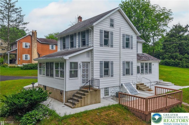 1911 Echo Rd, North Whitehall Twp, PA 18080 - back of house with a lawn and a chimney