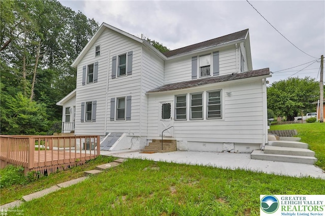 1911 Echo Rd, North Whitehall Twp, PA 18080 - back of property featuring a wooden deck, a lawn, and entry steps