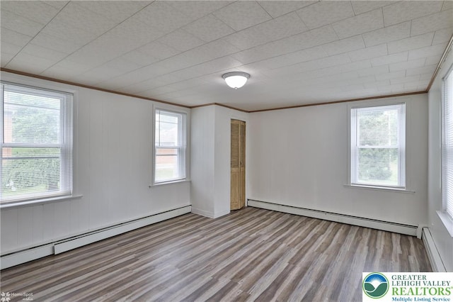 1911 Echo Rd, North Whitehall Twp, PA 18080 - spare room with baseboard heating, crown molding, wood finished floors, and healthy amount of natural light