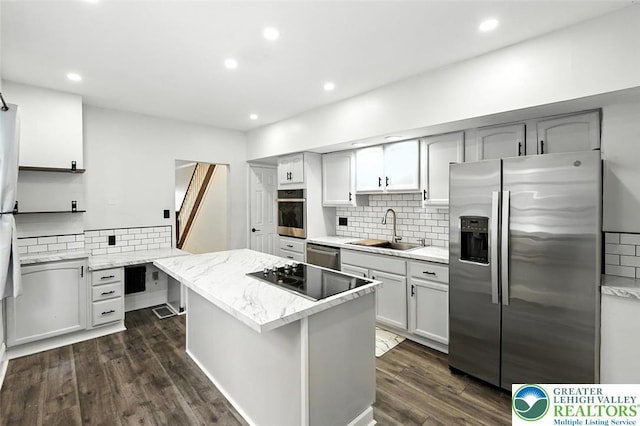 215 Tohickon Ave, Quakertown Boro, PA 18951 - kitchen featuring stainless steel appliances, decorative backsplash, a kitchen island, recessed lighting, and dark wood finished floors