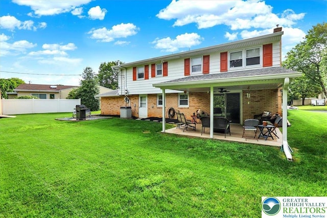 812 Miller St, Salisbury Twp, PA 18103 - back of property featuring a patio area, brick siding, ceiling fan, and a chimney
