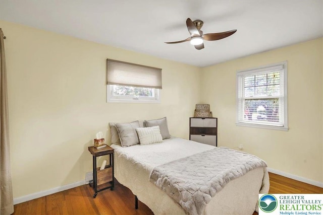 812 Miller St, Salisbury Twp, PA 18103 - bedroom with multiple windows, wood finished floors, and ceiling fan