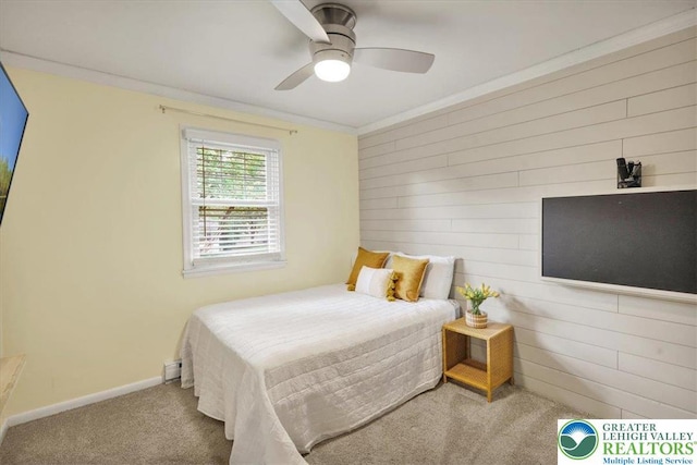812 Miller St, Salisbury Twp, PA 18103 - bedroom with carpet, wood walls, a ceiling fan, and ornamental molding
