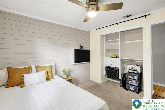 812 Miller St, Salisbury Twp, PA 18103 - carpeted bedroom featuring wooden walls and ceiling fan
