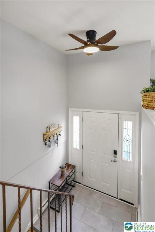 812 Miller St, Salisbury Twp, PA 18103 - foyer entrance featuring light tile patterned flooring and ceiling fan