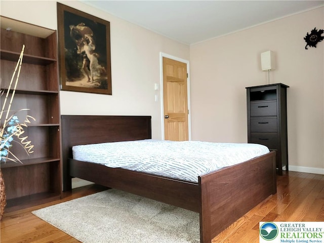 1025 Cricket Ln, Tobyhanna Twp, PA 18334 - bedroom featuring wood finished floors and ornamental molding