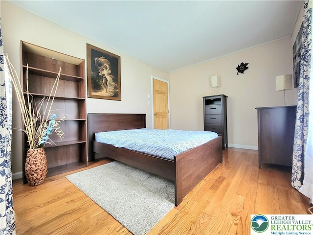 1025 Cricket Ln, Tobyhanna Twp, PA 18334 - bedroom with wood finished floors and ornamental molding