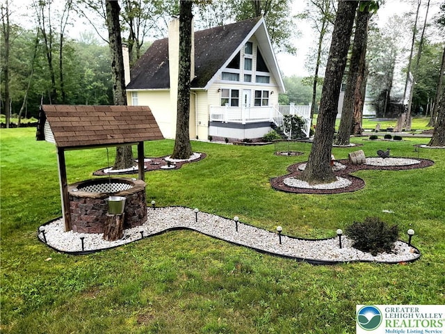 1025 Cricket Ln, Tobyhanna Twp, PA 18334 - rear view of property featuring a lawn and a chimney