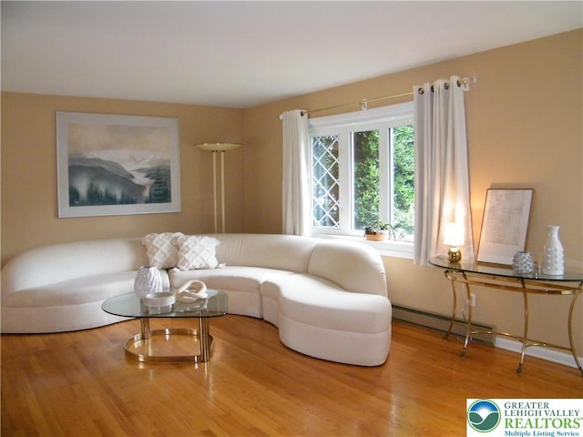 3415 Kathleen Ave, Salisbury Twp, PA 18103 - living room with wood finished floors and a baseboard heating unit