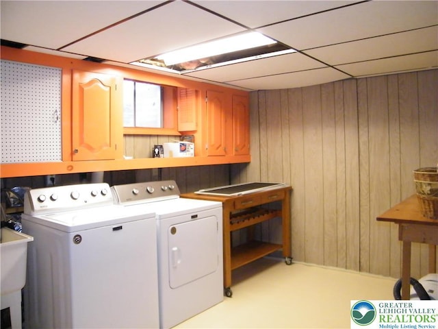 3415 Kathleen Ave, Salisbury Twp, PA 18103 - washroom featuring washer and dryer, cabinet space, and wooden walls
