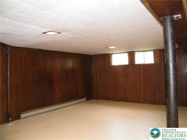 3415 Kathleen Ave, Salisbury Twp, PA 18103 - basement featuring wood walls and a baseboard radiator