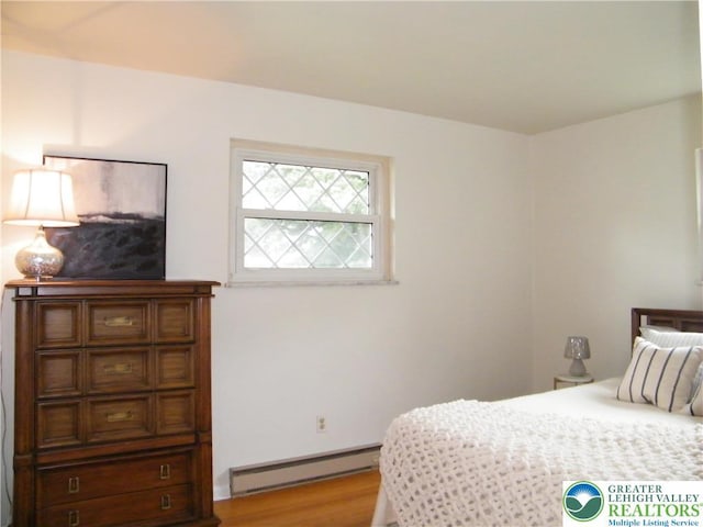 3415 Kathleen Ave, Salisbury Twp, PA 18103 - bedroom with baseboard heating and wood finished floors