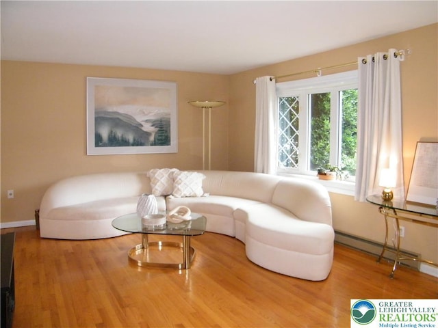 3415 Kathleen Ave, Salisbury Twp, PA 18103 - living area featuring a baseboard heating unit and wood finished floors