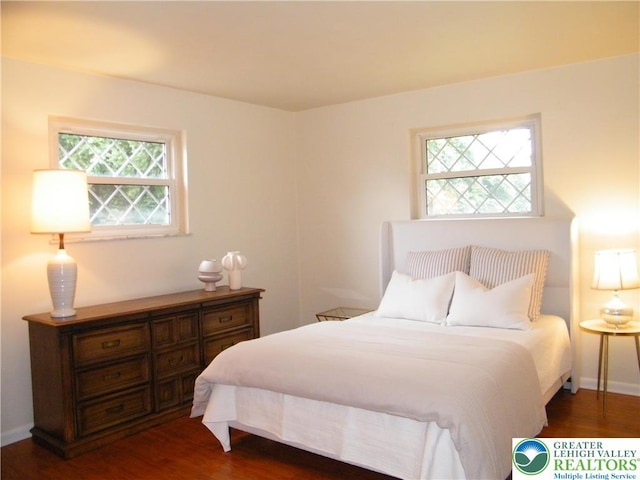 3415 Kathleen Ave, Salisbury Twp, PA 18103 - bedroom with dark wood-type flooring and baseboards