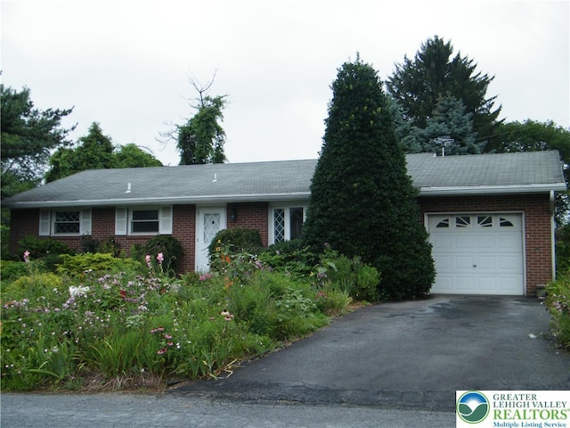 3415 Kathleen Ave, Salisbury Twp, PA 18103 - ranch-style home featuring a garage, asphalt driveway, and brick siding