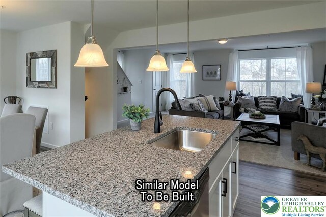 3229 Tepes Dr Lot 138, Allen Twp, PA 18067 - kitchen featuring dark wood-style flooring, open floor plan, white cabinetry, and light stone countertops