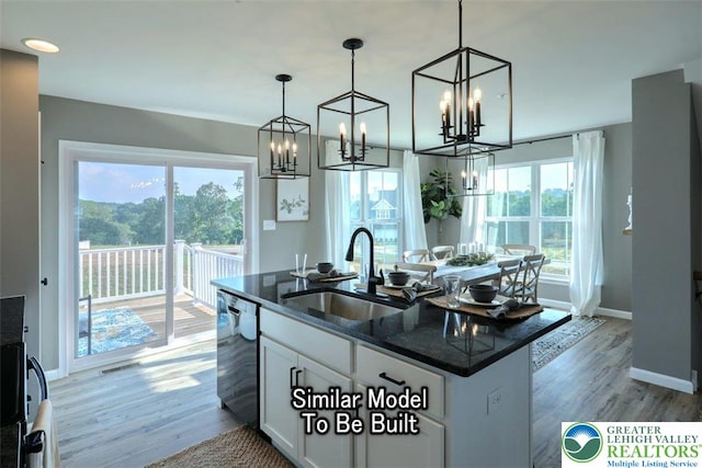 3229 Tepes Dr Lot 138, Allen Twp, PA 18067 - kitchen with dishwasher, white cabinets, a chandelier, light wood-style flooring, and an island with sink