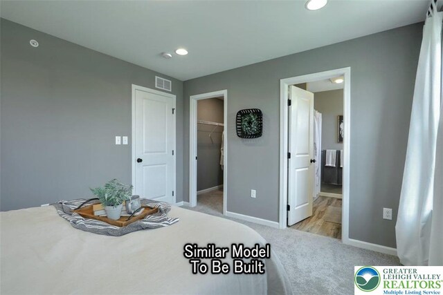 3229 Tepes Dr Lot 138, Allen Twp, PA 18067 - unfurnished bedroom featuring carpet floors, a walk in closet, recessed lighting, and connected bathroom